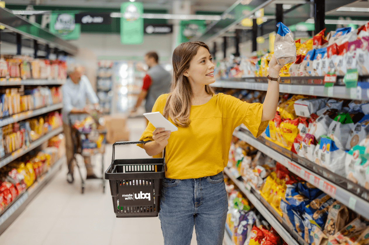 Consumer checking the product packaging at a supermarket alley.